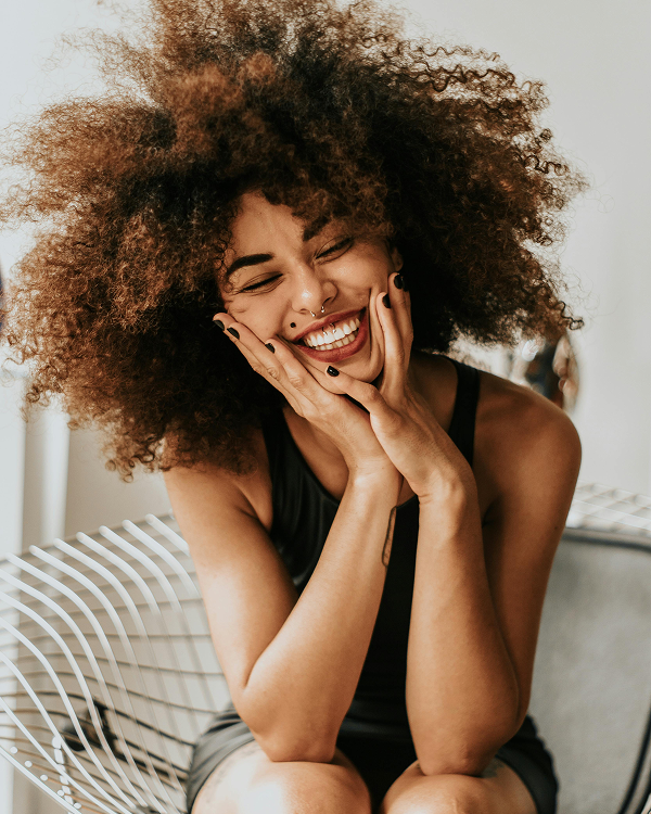 Women smiling on a couch