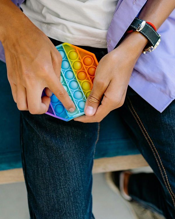 person using a fidget toy